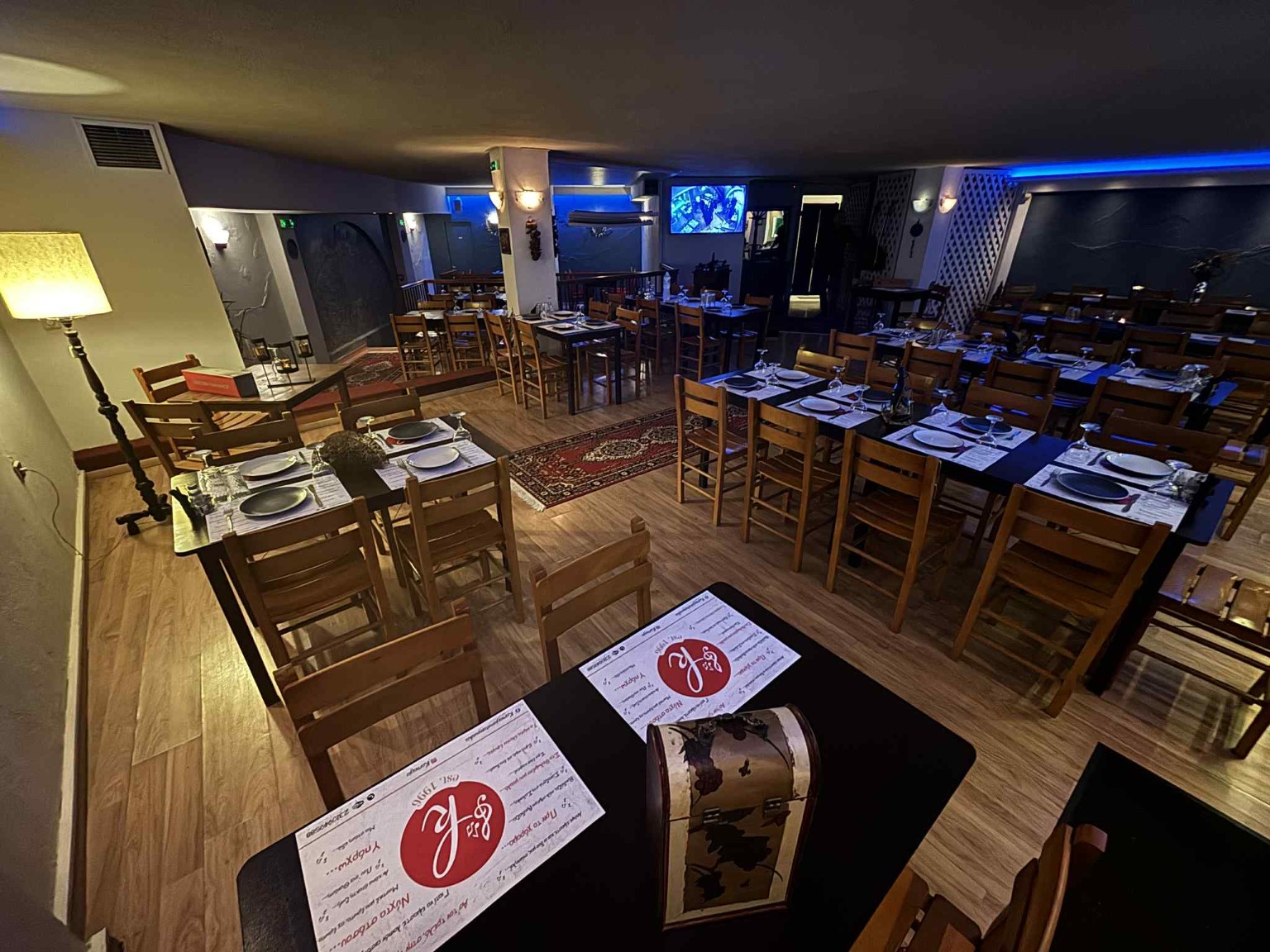 The stage and tables in the live music room at Karnagio, Thessaloniki